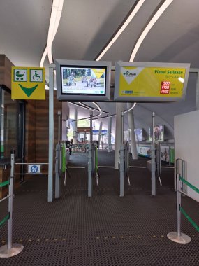 Schladming, Ennstal, Styria, Austria, July 12, 2024: Empty entrance to Planai cable car with automatic access with turnstiles in summer. clipart