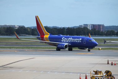 Arlington, VA, USA - September 19, 2024: Southwest Airlines aircraft Boeing 737 7H4 taxiing at Ronald Reagan Washington National Airport DCA at daytime. clipart