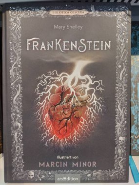 Vienna, Austria, October 22, 2024: Beautiful illustrated german edition of English author Merry Shelleys novel Frankenstein. An 1818 written horror story about a scientific experiment. Vertical image clipart