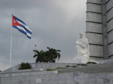 Plaza de la Revolucion, Havana, Cuba - March 14, 2009: Revolution Square with Jose Marti Memorial and Cuban flag on a cloudy day in Havana. clipart