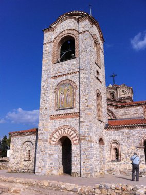 Ohrid, North Macedonia - October 07, 2011: Bell tower on the side of Church of Saints Clement and Panteleimon. An icon above the entrance depicts both saints. clipart