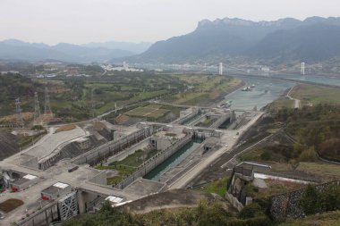 Sandouping, Yiling, Yichang, Hubei, China - March 14, 2017: Panoramic view to impressive Three Gorges Dam, Yangtze River and surrounding landscape. clipart