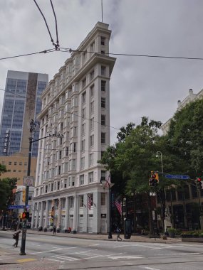 Atlanta, GA, USA - September 28, 2024: Flatiron Building built 1897 in downtown Atlanta. Designed by Bradford Gilbert. Shares similar prominent flatiron shape as its counterpart in Ney York City. clipart