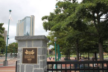 Atlanta, GA, USA - September 28, 2024:  View of sign at at entrance to Centennial Olympic Park in downtown Atlanta, Georgia. 22-acre (89,000 m2) public park. Built as part for the 1996 Summer Olympics clipart