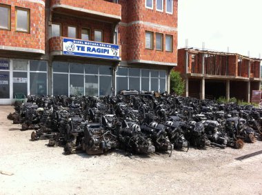 Lebane, Pristina, Kosovo - May 29, 2011: Collection of used oily engine blocks in front of workshop 