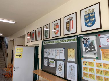 Ganserndorf, Lower Austria - January 26, 2025: Entrance door to polling station established in an Austrian school building during Municipal council election. clipart