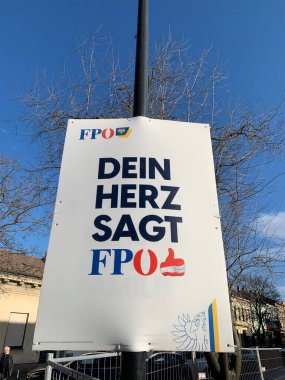 Ganserndorf, Lower Austria - January 26, 2025: Election poster of FPOE, Freedom Party of Austria, on billboard stand mounted on light pole. German Slogan: 