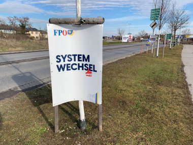 Ganserndorf, Lower Austria - January 26, 2025: Election posters of FPOE, Freedom Party of Austria, on billboard stands at roadside. clipart