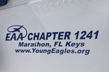 Marathon, FL, US - February 14, 2020: Detail of logo and lettering found on aircraft fuselage in EAA Air museum Chapter 1241 at Florida Keys Marathon Airport. clipart