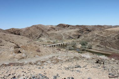 Kuiseb River, Namibia - March 13, 2018: Bridge of C14 or MR 36 road over the Kuiseb Canyon. clipart