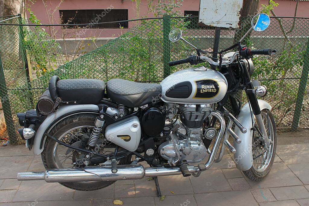 Agra, Uttar Pradesh, India - March 11, 2019: Beautiful first generation Royal Enfield Classic 350 motorcycle parked in downtown.