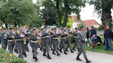 Wiener Neustadt, Lower Austria - September 27, 2025: Colorful ceremonial marching in of various field signs from units of Austrian Armed Forces during 