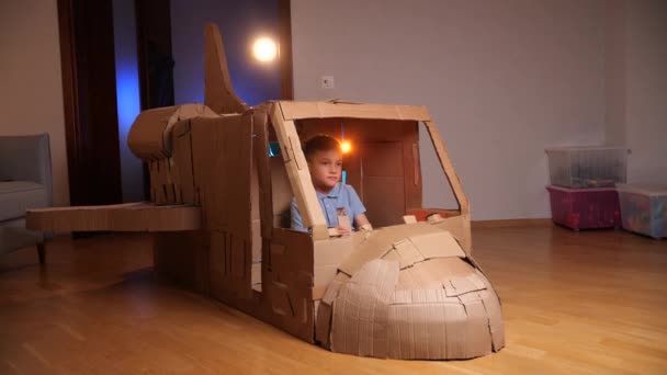 Boy Controls Space Shuttle Child Plays Cardboard Spaceship Boy Plays — Video