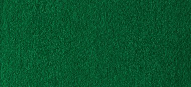 Yeşil renk tekstil kumaş kumaş dokusu arkaplanı. Soyut tek renkli koyu mavi renk keçeli arka plan.