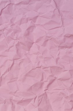 Pastel pembe buruşuk kağıt doku arkaplanı. Soyut pembe renk dikey arkaplan.