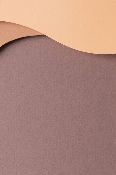 Abstract colored paper texture background. Minimal paper cut style composition with layers of geometric shapes and lines in shades of beige and brown colors. Top view, copy space