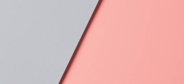 Soyut renkli kağıt dokusu arkaplanı. Pastel pembe ve açık mavi renkte minimal geometrik şekiller ve çizgiler.