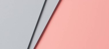 Soyut renkli kağıt dokusu arkaplanı. Pastel pembe ve açık mavi renkte minimal geometrik şekiller ve çizgiler.