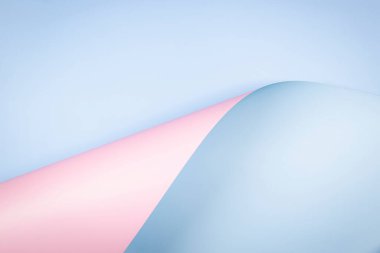 Abstract geometry composition background in pastel blue and pale pink colors with geometric shapes and curved wave lines. Top view, copy space.