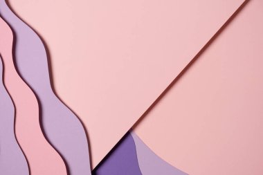 Abstract colored paper texture background. Minimal paper cut composition with layers of geometric shapes and lines in pastel pink and violet purple colors. Top view, copy space.