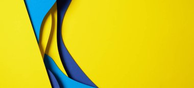 Abstract colored paper texture background. Minimal paper cut composition with layers of geometric shapes and lines in light blue, navy blue, yellow colors.