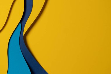 Abstract colored paper texture background. Minimal paper cut composition with layers of geometric shapes and lines in light blue, navy blue, yellow colors.