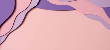 Abstract colored paper texture background. Minimal paper cut composition with layers of geometric shapes and lines in pastel pink and violet purple colors. Top view, copy space.