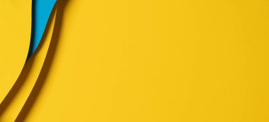 Abstract colored paper texture background. Minimal paper cut composition with layers of geometric shapes and lines in light blue and yellow colors.
