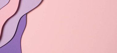 Abstract colored paper texture background. Minimal paper cut composition with layers of geometric shapes and lines in pastel pink and violet purple colors. Top view, copy space.