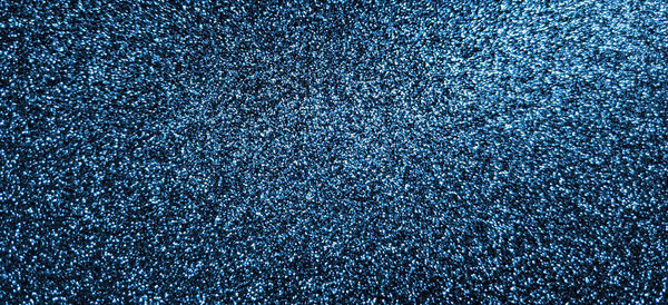 Abstract navy blue glitter texture background.