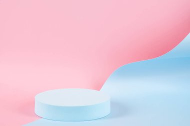 Abstract trendy composition with empty round podium platform for product or cosmetics presentation on pastel pink and light blue background. Trendy modern curved shaped lines. Front view.