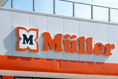 Finestrat, Spain - March 2, 2023: Muller logo sign on storefront. Muller - German drugstore chain, that also sells cosmetics, perfumes, organic food, stationery, toys, multimedia and other products.