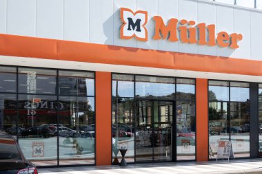 Finestrat, Spain - March 2, 2023: Muller logo sign on storefront. Muller - German drugstore chain, that also sells cosmetics, perfumes, organic food, stationery, toys, multimedia and other products.