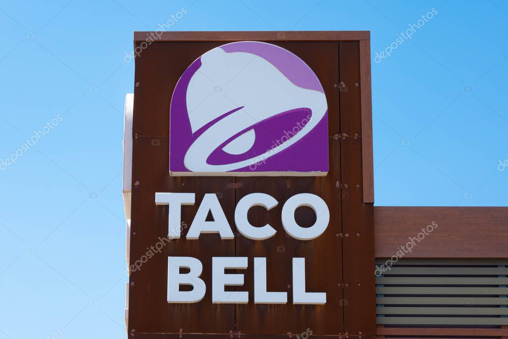Finestrat, Spain - March 2, 2023: Taco Bell logo on Taco Bell restaurant wall. Taco Bell is American-based chain of fast food restaurants, witch serve variety of Mexican-inspired foods.