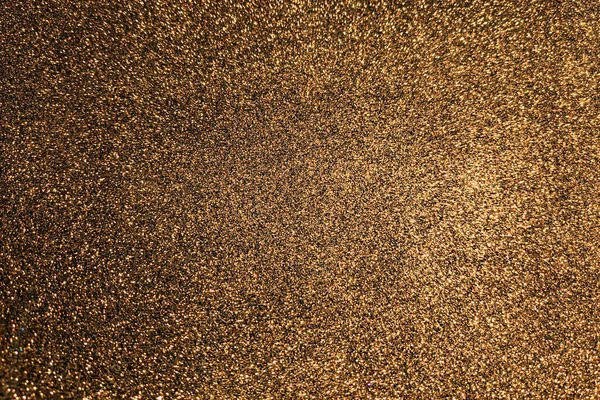 Abstract gold brown glitter texture background.