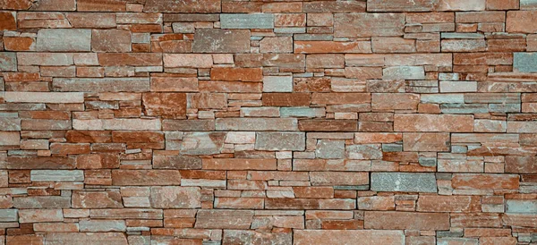 stock image Modern stone brick wall surface background. Brown masonry wall of stones with irregular pattern texture background.
