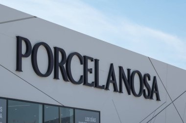 Finestrat, Spain - March 2, 2023: Porcelanosa logo sign on storefront. Porcalanosa is Spanish manufacturer, distributor and retailer of ceramic tiles.