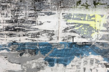 Old grunge torn collage urban street posters creased crumpled paper placard texture background. Ripped faded paper backdrop surface placard.