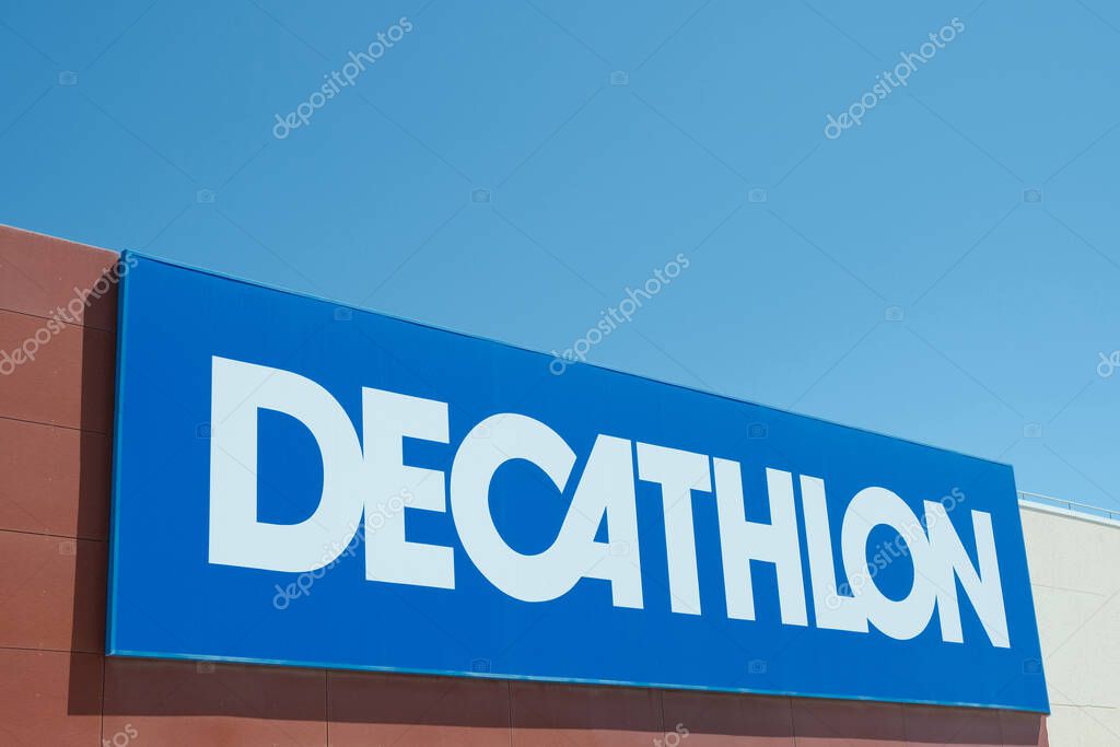 Decathlon logo sign on Decathlon store facade. Decathlon is popular French sporting goods retailer. Spain, Alicante province - 12 April, 2023.