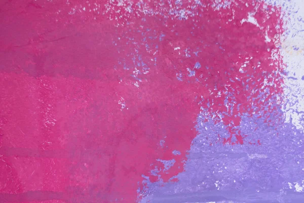 Messy paint strokes and smudges on an old painted wall background. Abstract white wall surface with part of pink purple graffiti. Colorful drips, flows, streaks of paint and paint sprays.