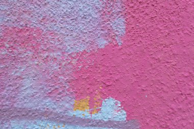 Pink, magenta, white painted plaster wall surface background with colorful drips, flows, streaks of paint and paint sprays