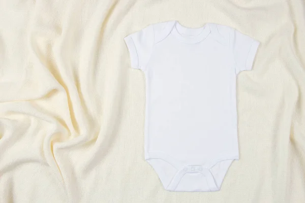 Top View White Cotton Baby Short Sleeve Bodysuit Beige Blanket — Stock Photo, Image