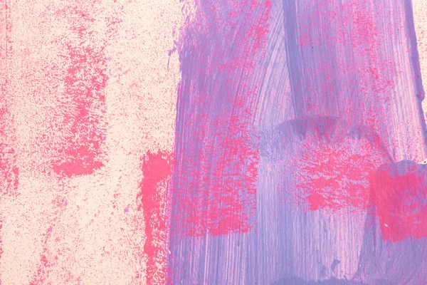Messy paint strokes and smudges on an old painted wall. Pink, purple, beige color drips, flows, streaks of paint and paint sprays.
