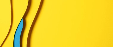 Abstract colored paper texture background. Minimal paper cut composition with layers of geometric shapes and lines in light blue and yellow colors.