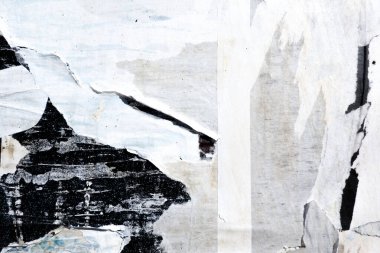 Old grunge torn collage urban street posters creased crumpled paper placard texture background. Ripped faded paper backdrop surface placard.