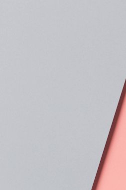 Soyut renkli kağıt dokusu arkaplanı. Kopyalama alanı ile minimal açık gri ve soluk pembe arkaplan.