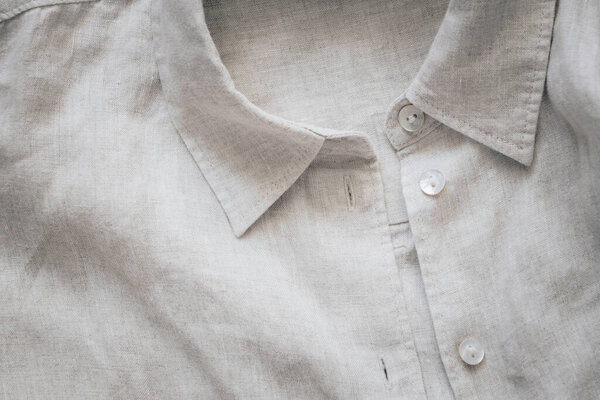 Close up of gray linen shirt. Top view.
