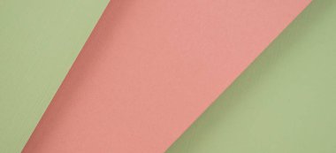 Soyut geometrik kağıt düz kompozisyon arka planı açık yeşil ve pastel pembe renklerle.
