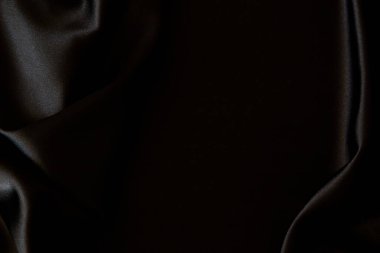 Güzel siyah ipek kumaş arka plan. Üst görünüm.