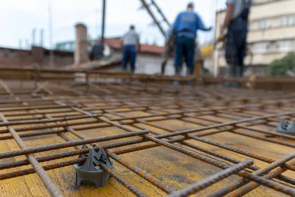 Web of metal rebar or armature steel  on the construction site, concrete plate is about to be made, steel rebar for support and strength. Reinforced concrete iron on the construction site